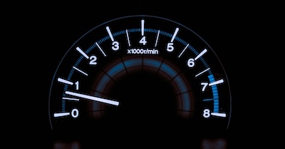 White and blue analogue tachometer gauge